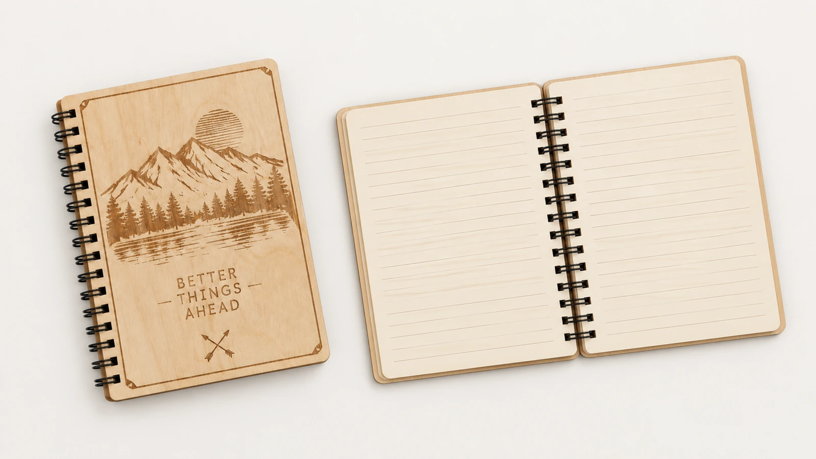 Caderno fechado e miolo pautado Caderno fechado de madeira compensada com desenho de montanha, ao lado de um caderno aberto com páginas pautadas